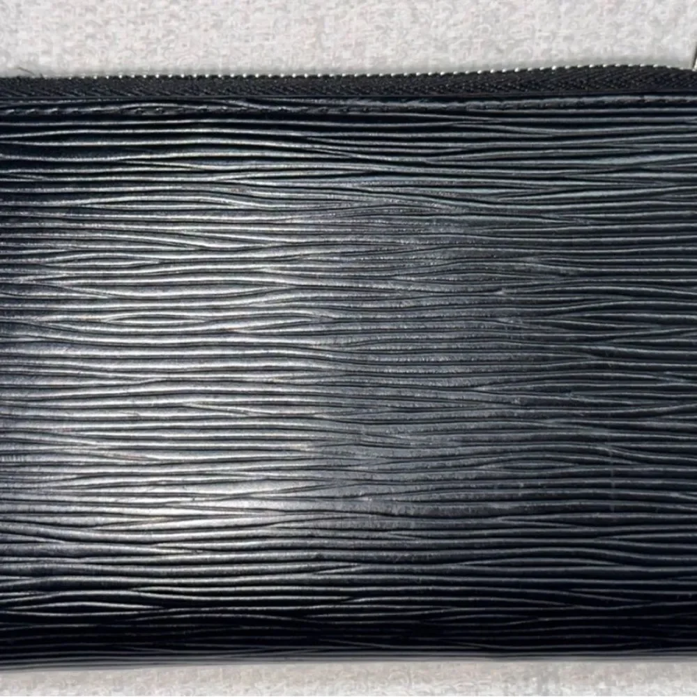 Auth Louis Vuitton black epi‎ wallet silver hardware.